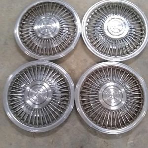 1987 set of 4 cougar hubcaps with centers